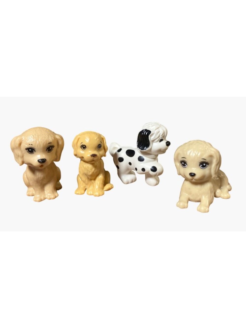 Miniature puppy dog figures from various Barbie doll playsets made by Mattel